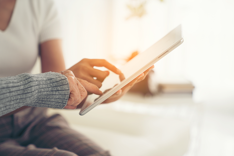 People giving support over tablet
